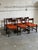 Set of 6 vintage Danish dining chairs designed by Hans Wegner for Getama, featuring solid teak frames and vibrant orange...