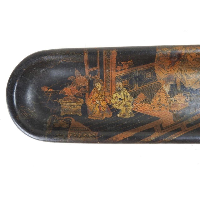 Antique late 19th century paper mache chinoiserie pen or trinket tray. Black with gold figures, age darkening, wear to...