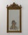 A 19th century French wall mirror in the Napoleon III style, featuring a structured frame with balanced proportions. The...