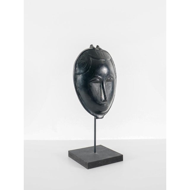 Roger capron (1922 - 2006) mask no. 2 france, circa 1960 glazed ceramic h: 24 cm / w: 16 cm / d: 7 cm base: 32.5 cm x 12...