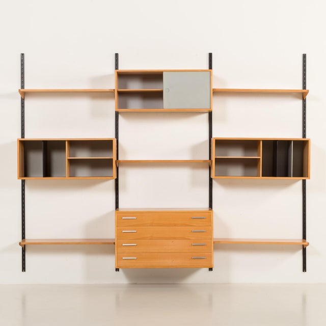 This extremely rare wall unit in beech was manufactured in denmark in the late 1970s by fm møbler, which is validated by...