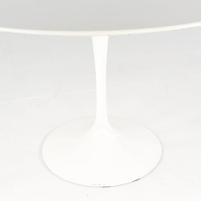 Eero Saarinen for Knoll Mid Century Tulip Table This dining table measures: 47.25 wide x 47.25 deep x 28.5 inches high,...