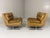 Set of 2 lounge chairs. Chrome plated metal frame, furnished in cognac leather, loose seat pilows, the back pillows are...