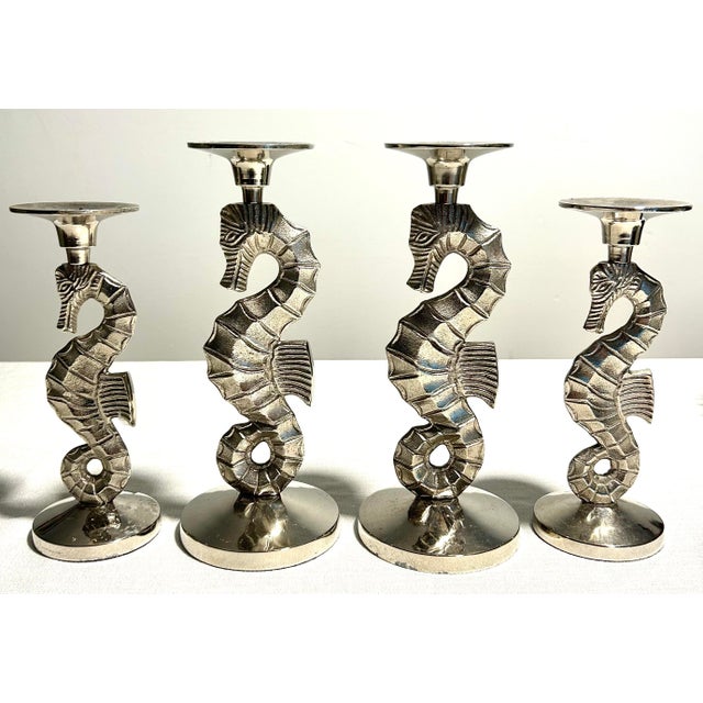This rare 4-piece set of Mid-Century Modern Andrea by Sadek silverplate seahorse candlestick holders blends coastal...