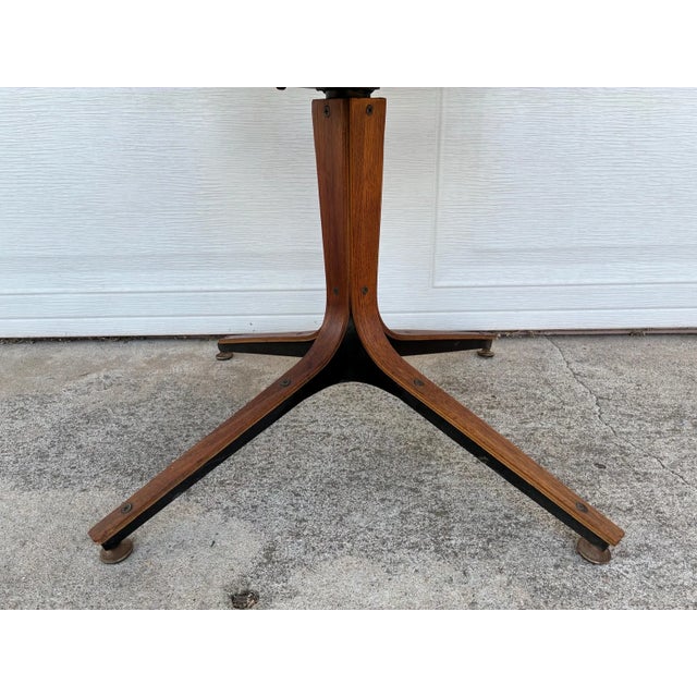 Add iconic mid-century modern style to your workspace with this vintage Plycraft 360-degree swivel desk chair. Designed by...