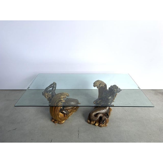 Stunning mid 20thc entury italian coffee table in the form of two female blackamoor mermaids supporting a large clear...