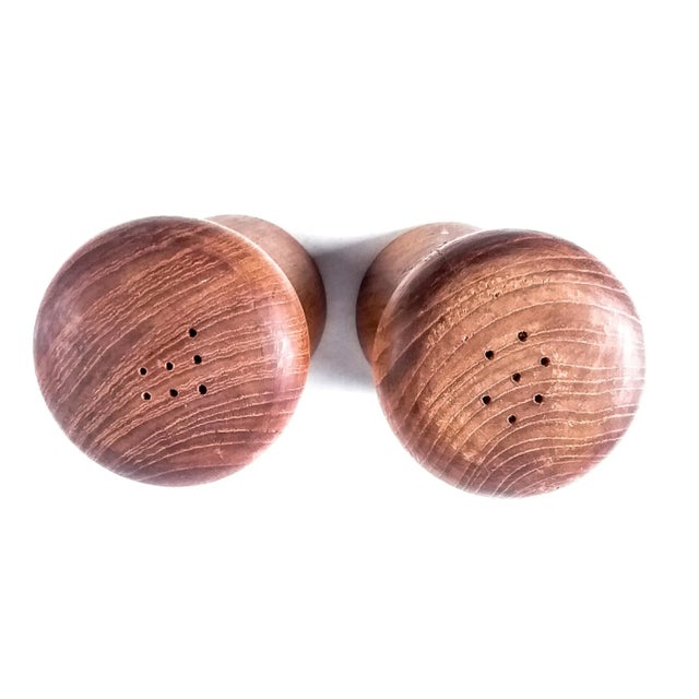 Simple Scandinavian design shakers carved from wood. Top has holes marking a P for pepper and an S for salt. In wonderful...