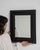 This mirror makes its impression through black frame, rectangular. Originating in France during 20th Century, it shows the...