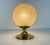 A beautiful table lamp by doria made in germany in the 1970s. It has a brass base and the glass shade is made of frosted...