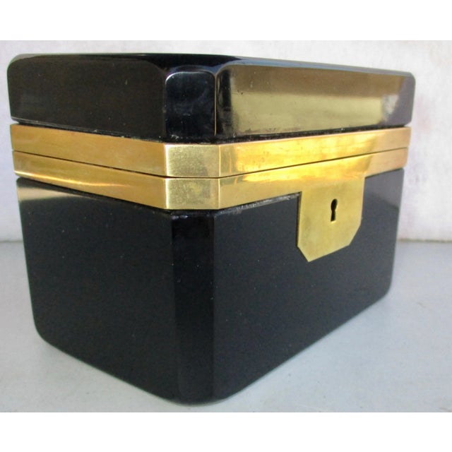 Early French Black glass and bronze casket. Glossy smooth surface and bronze mountings. Un embellished trim and surface ....