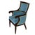 An English Regency style mahogany library armchair distinguished by its refined proportions, gracefully scrolled arms, and...