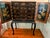 18th Century Chinese Export Lacquer and parcel gilt Cabinet on Stand with a pair of chinoiserie decorated doors depicting...