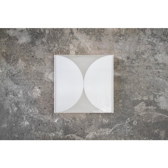 Two-tone glass wall or ceiling lamp with metal frame. Clessidra model Designer Bobo Piccoli Manufacturer Fontana Arte....