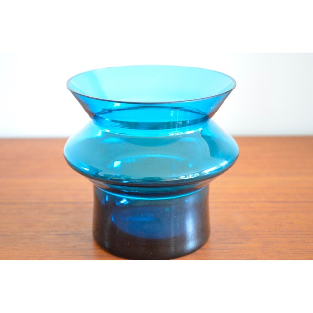 Finnish glass vase by designer Helena Tynell for Riihimäen Lasi Oy. Blue colored glass in a stubby spindle shape I have...