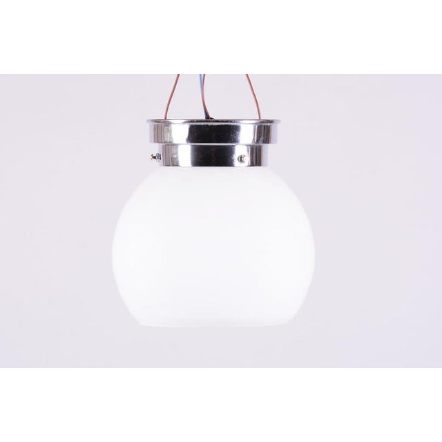 This elegant ceiling lamp is a classic example of 1930s Czechoslovak design, which was strongly influenced by the ideas of...