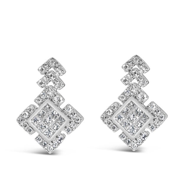 Discover the epitome of elegance with these scintillating 10K white gold earrings, exquisitely crafted to dangle with...