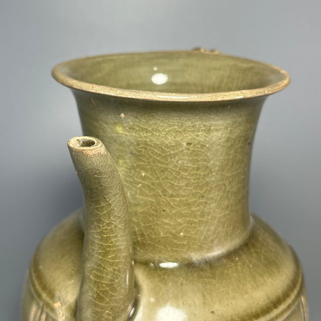 Fine antique Chinese celadon ewer pitcher. Features carved vertical segmented decoration across rounded body, classic...