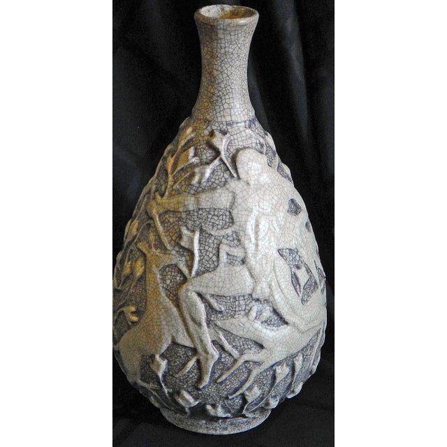 A highly unusual vase by Jean Mayodon, one of France's leading artists in the Art Deco era, this piece depicts two scenes...