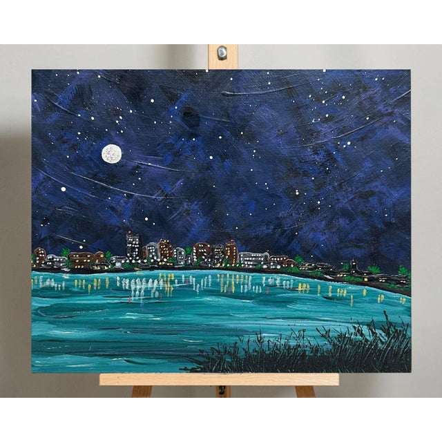 Add a calming and unique ambiance to your space with this hand-painted night cityscape titled "City Nights". It depicts a...