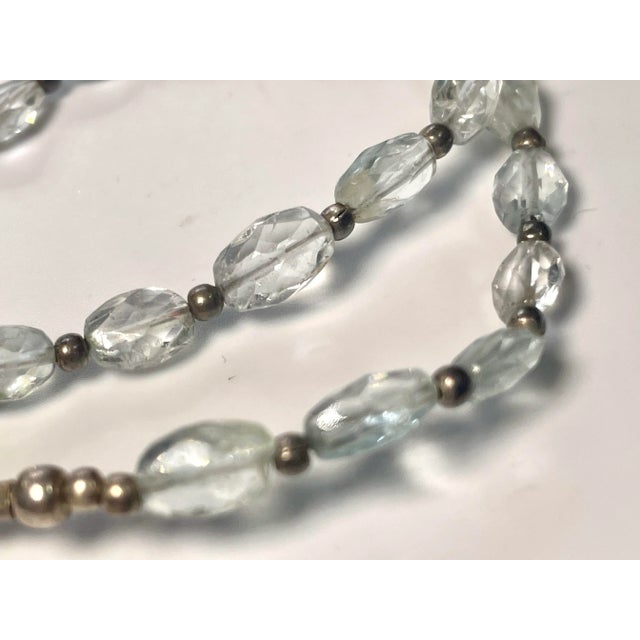 The aquamarine gemstone necklace is 17” including the clasp. The clasp is solid sterling silver, art deco in style and...