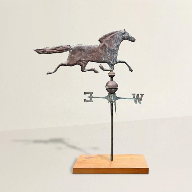 A true piece of American folk sculpture, this early 20th century copper running thoroughbred weathervane carries the...