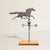 A true piece of American folk sculpture, this early 20th century copper running thoroughbred weathervane carries the...
