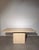 Striking vintage dining table crafted in natural beige travertine , featuring a clean architectural design and beautifully...