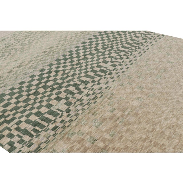 Hand-knotted in wool and silk, this 8x10 contemporary rug from Rug & Kilim features geometric patterns with a modern...