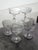 Seven crystal champagne coupes, 1950s-60s. This crystal champagne coupe features an elegant and classic silhouette,...