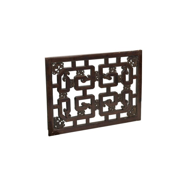 Exquisitely crafted from aged dark wood with a warm, time-softened patina, this antique architectural wood carving...