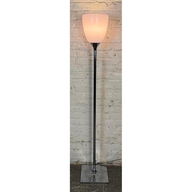This vintage chrome floor lamp with smoked glass torchiere shading is an example of space age or atomic design trends in...