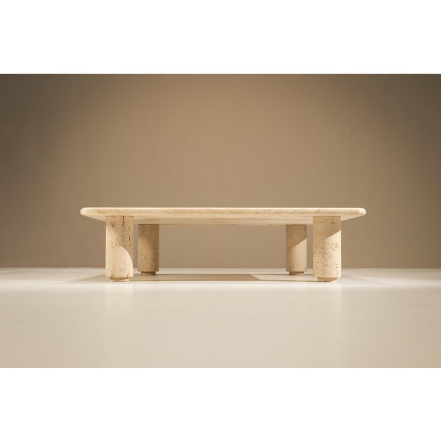 A quiet sense of balance defines this travertine coffee table. Reduced to its essential geometry, the design relies on the...