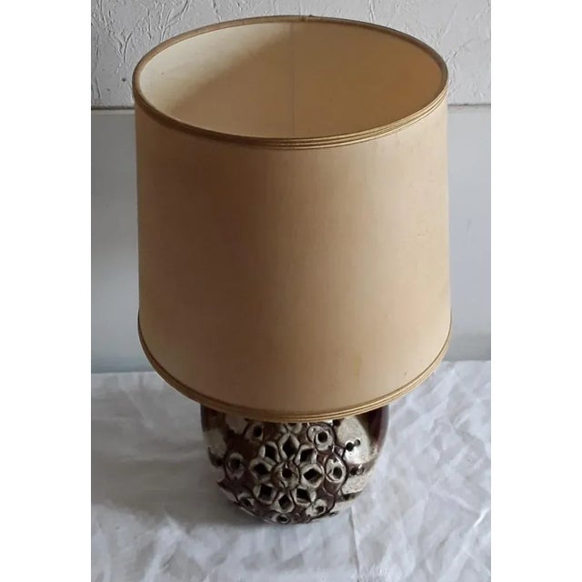 Vintage table lamp with brown and beige ceramic base with interior lighting and a beige fabric shade from the 70s European...