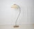 Swedish modern floor lamp in polished steel. The lamp is from around 1930 to 1940 and is made in Sweden. The lamp shade is...