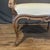 Elegant 19th century French carved walnut bench featuring a shaped upholstered seat, gracefully scrolled open arms and...