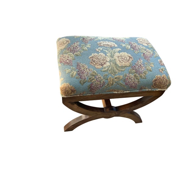 Modern pair of ottomans. The set is done in a modern multi colored chenille. The finish is walnut. The frames are made of...