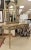 LaBarge Louis XVI–style painted vanity table with coordinating mirror and upholstered vanity bench. Features an antiqued...
