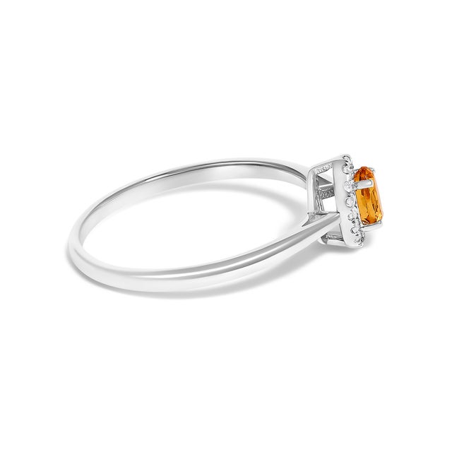 Contemporary 10K White Gold 5X3MM Oval Orange Citrine and Diamond Accent Halo Ring (I-J Color, I1-I2 Clarity) - Ring Size 7 For Sale - Image 3 of 7