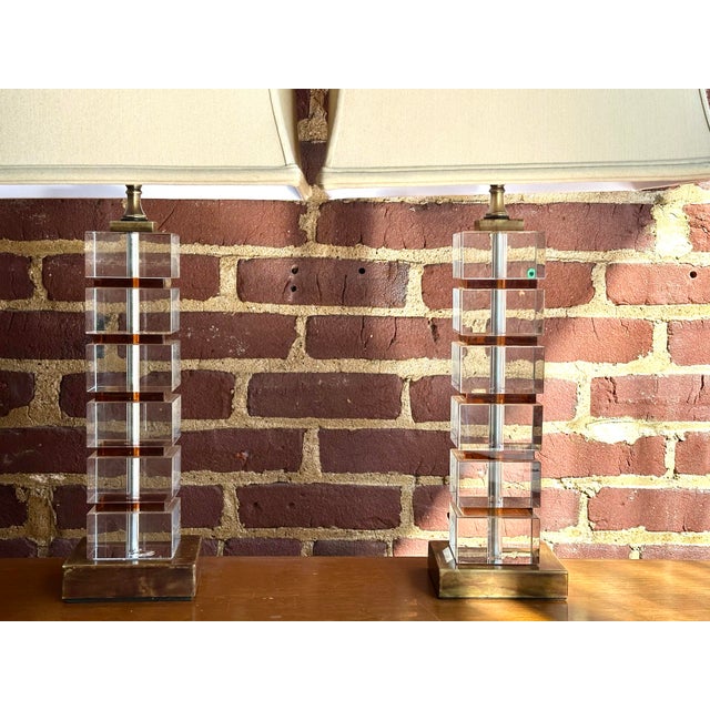 Beautiful pair of stacked lucite and marble table lamps. These timeless beauties were discovered at a fine Virginia estate...