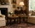 A striking pair of Baker Furniture accent tables showcasing elegant Chinoiserie-inspired design with rich decorative...