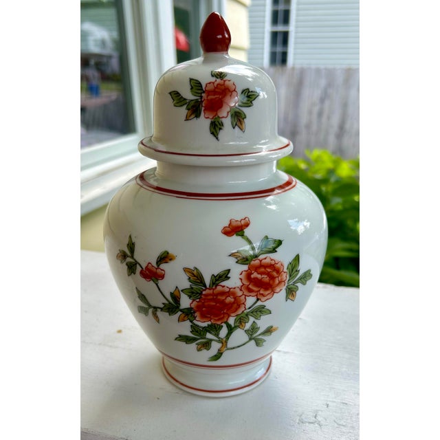 Charming vintage chinoiserie ginger jar by Andrea Sadek. This porcelain jar features a delicate hand-painted floral design...