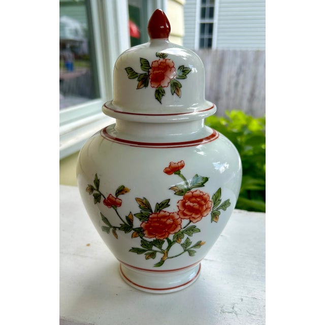 Charming vintage chinoiserie ginger jar by Andrea Sadek. This porcelain jar features a delicate hand-painted floral design...