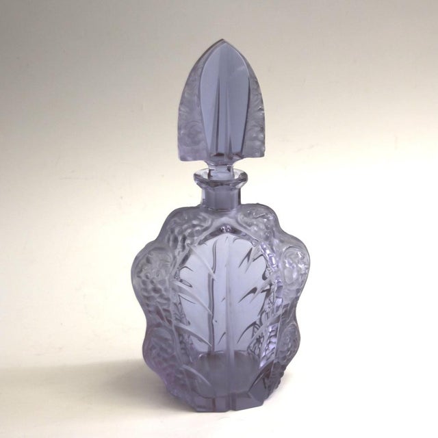 7-piece set made of lilac-colored crystal glass with carafe and 6 liqueur glasses. The carafe is sealed airtight by a...