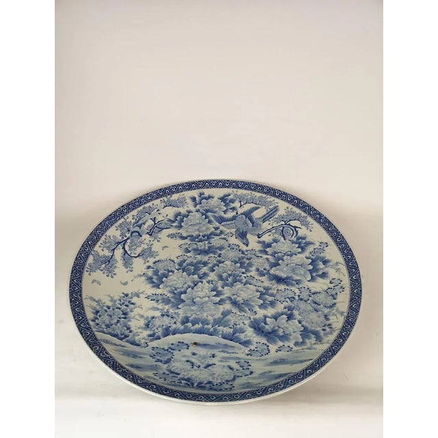 This very large plate made in japan during the emperor meiji time 1868-1912. Wonderful blue pattern on fine porcelain....