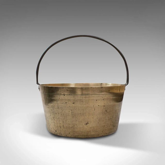This is a delightful antique preserving pan. An English, heavy brass jam cooking pot, dating to the late Georgian period,...