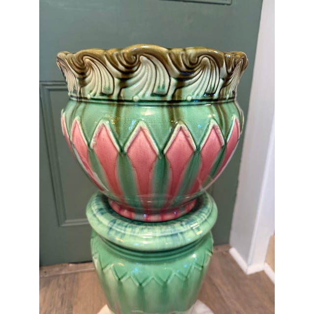 A show-stopping antique Weller Pottery jardiniere and pedestal with real sculptural presence. The jardiniere's rim swirls...