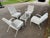 This 1950s Woodard style white Chantilly rose 5 pieces Patio coffee Table and 4 lounge chairs Set is a wrought iron patio...