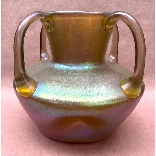 Here we have a loetz vase , a brilliant iridescent shine , four applied handles and dimples , very good cond with a...