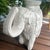 Add whimsical sculptural artistry and timeless character to your home with this vintage white Mexican cast concrete...