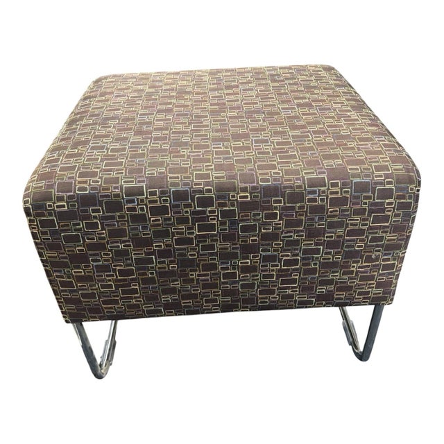 This product is a vintage Mid-Century Modern 28" rectangular ottoman footstool with chrome legs, featuring a unique brown,...